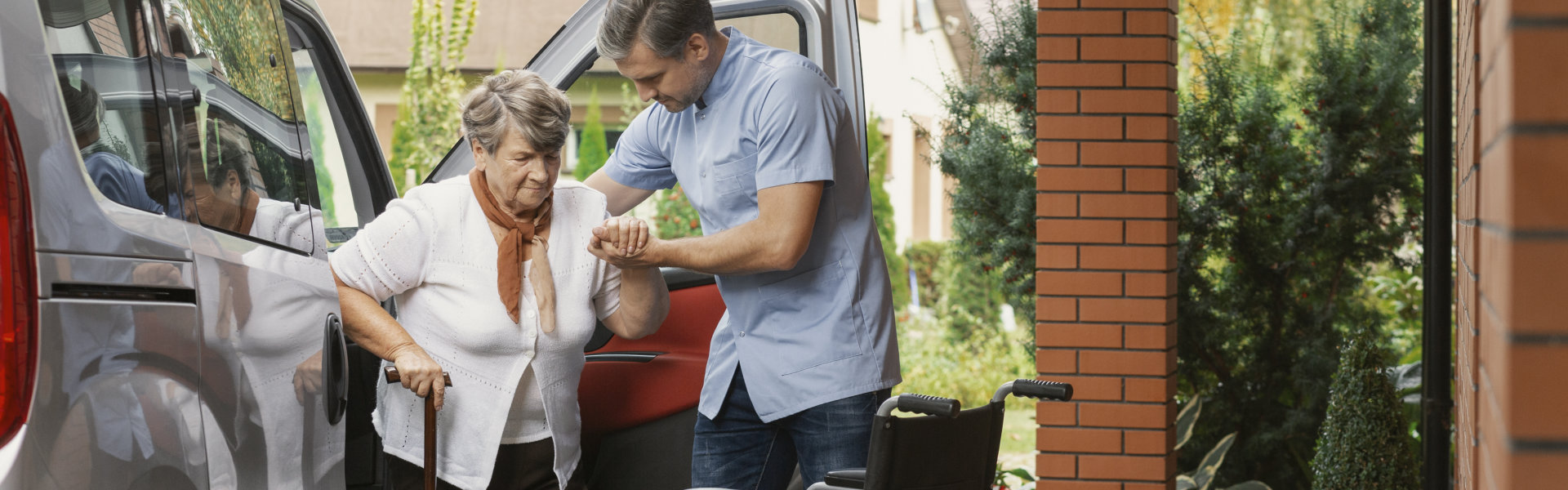 man helping elderly woman