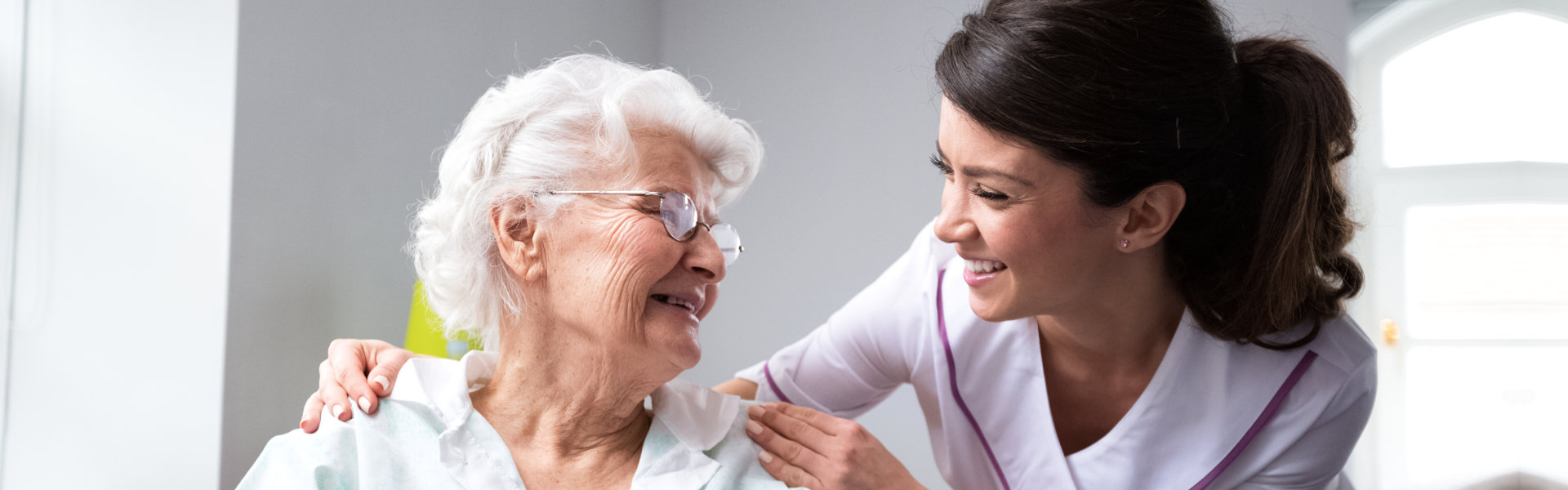 woman smiling to elderly woman