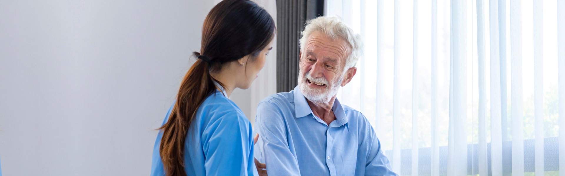 woman helping to elderly man